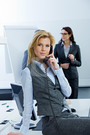 To use this stock image in your creative project, please select the size you need over to the right and click the "Add to Cart" button.
Your downloaded image will come with the Cutcaster watermark removed so don’t worry about the watermark you see on this page. Business Woman stock photo, Woman talking on phone in conference room by Alexander Beck