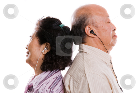 Senior asian couple listening to music Senior asian couple listening to music stock photo, An isolated shot of a senior asian couple listening to music by Suprijono Suharjoto