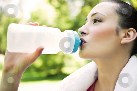 To use this stock image in your creative project, please select the size you need over to the right and click the "Add to Cart" button.
Your downloaded image will come with the Cutcaster watermark removed so don’t worry about the watermark you see on this page. Caucasian woman drinking water stock photo, A beautiful caucasian woman doing exercise drinking water in a park by Suprijono Suharjoto