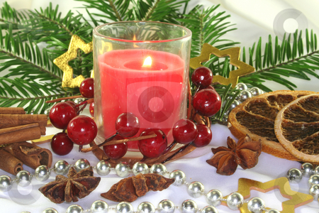 To use this stock image in your creative project, please select the size you need over to the right and click the "Add to Cart" button.
Your downloaded image will come with the Cutcaster watermark removed so don’t worry about the watermark you see on this page. Christmas stock photo, Red candle with Christmas ball, stars and pine branches on a light fabric by Marén Wischnewski