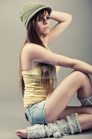 To use this stock image in your creative project, please select the size you need over to the right and click the "Add to Cart" button.
Your downloaded image will come with the Cutcaster watermark removed so don’t worry about the watermark you see on this page. Side pose of beautiful model sitting with green cap stock photo, Side pose of beautiful model sitting with green cap indoor studio by Get4net