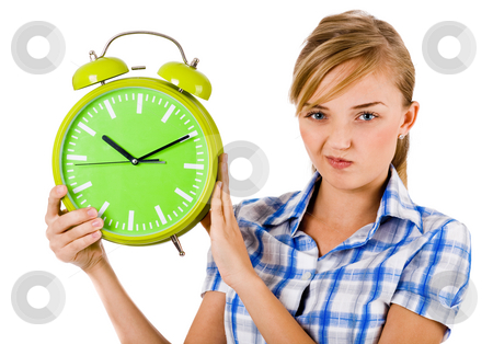 Girl giving funny expression and holding the alarm Girl giving funny expression and holding the alarm stock photo, Girl giving funny expression and holding the alarm on a isolated white background by Get4net