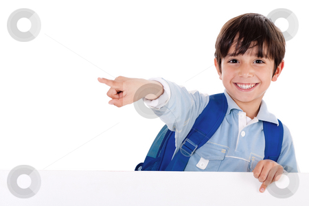 Smiling young boy standing behind the blank board and pointing us Smiling young boy standing behind the blank board and pointing us stock photo, Smiling young boy standing behind the blank board and pointing us on isolated white background by Get4net