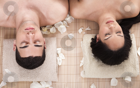 To use this stock image in your creative project, please select the size you need over to the right and click the "Add to Cart" button.
Your downloaded image will come with the Cutcaster watermark removed so don’t worry about the watermark you see on this page. Beautiful relaxing couple in a spa closeup shot stock photo, Beautiful relaxing couple in a spa closeup shot in white background by Get4net