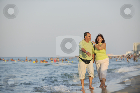 Happy seniors couple on beach Happy seniors couple on beach stock photo, Happy senior mature elderly people couple have romantic time on beach at sunset by Benis Arapovic