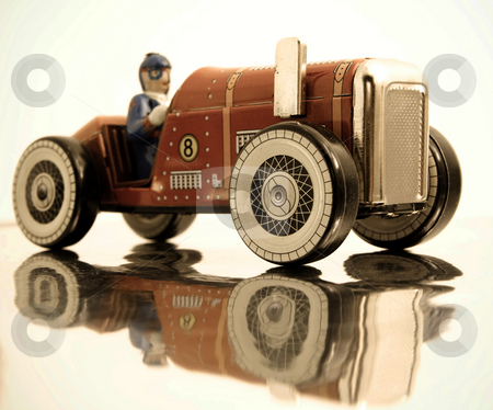 To use this stock image in your creative project, please select the size you need over to the right and click the "Add to Cart" button.
Your downloaded image will come with the Cutcaster watermark removed so don’t worry about the watermark you see on this page. Car stock photo, Red retro race car by Charles Taylor