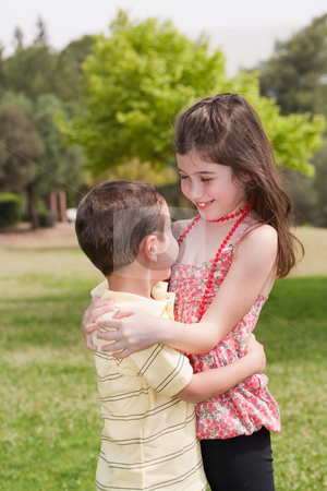 To use this stock image in your creative project, please select the size you need over to the right and click the "Add to Cart" button.
Your downloaded image will come with the Cutcaster watermark removed so don’t worry about the watermark you see on this page. Brother and sister affectionatly hugging stock photo, Brother and sister affectionatly hugging in the park, outdoor by Get4net