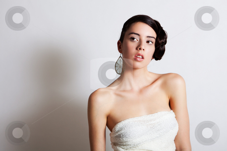 To use this stock image in your creative project, please select the size you need over to the right and click the "Add to Cart" button.
Your downloaded image will come with the Cutcaster watermark removed so don’t worry about the watermark you see on this page. Elegant Young Woman Modeling a Dress stock photo, Beautiful young woman poses with an elegant hairstyle and strapless dress. She is looking pensively off to the side. Horizontal shot. by Angela Hawkey