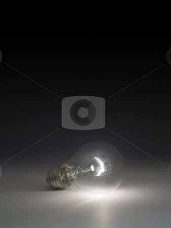 To use this stock image in your creative project, please select the size you need over to the right and click the "Add to Cart" button.
Your downloaded image will come with the Cutcaster watermark removed so don’t worry about the watermark you see on this page. Light bulb. stock photo, Luminous light bulb on black background. by Oleksiy Fedorov
