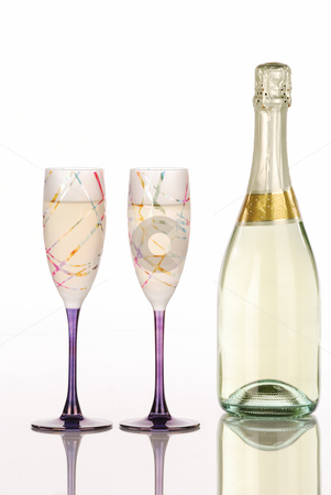 To use this stock image in your creative project, please select the size you need over to the right and click the "Add to Cart" button.
Your downloaded image will come with the Cutcaster watermark removed so don’t worry about the watermark you see on this page. Champagne bottle with two festive glasses stock photo, Champagne bottle with two festive glasses with white background by Hector Arencibia