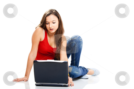 To use this stock image in your creative project, please select the size you need over to the right and click the "Add to Cart" button.
Your downloaded image will come with the Cutcaster watermark removed so don’t worry about the watermark you see on this page. Beautiful teenager stock photo, Beautiful young female student with a laptop, isolated on white by ikostudio