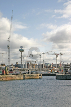 To use this stock image in your creative project, please select the size you need over to the right and click the "Add to Cart" button.
Your downloaded image will come with the Cutcaster watermark removed so don’t worry about the watermark you see on this page. Liverpool Docks stock photo, Liverpool Dockland and Construction Cranes UK England by Chris Green