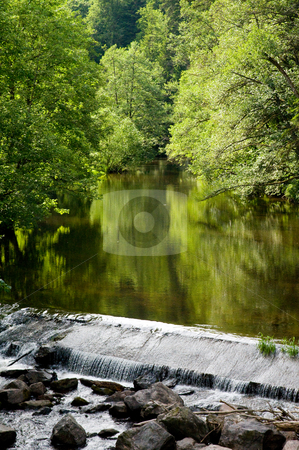 To use this stock image in your creative project, please select the size you need over to the right and click the "Add to Cart" button.
Your downloaded image will come with the Cutcaster watermark removed so don’t worry about the watermark you see on this page. Water weir stock photo, Calm river in the Black Forest plashes over a weir by Herb Allgaier