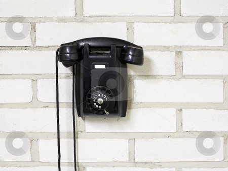 To use this stock image in your creative project, please select the size you need over to the right and click the "Add to Cart" button.
Your downloaded image will come with the Cutcaster watermark removed so don’t worry about the watermark you see on this page. Telephone stock photo, Black bakelite telephone on a brick wall. by Stocksnapper