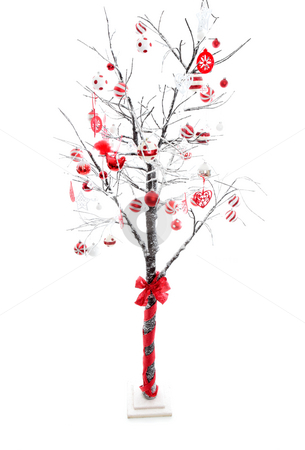 To use this stock image in your creative project, please select the size you need over to the right and click the "Add to Cart" button.
Your downloaded image will come with the Cutcaster watermark removed so don’t worry about the watermark you see on this page. Decorated Christmas Tree stock photo, Snow covered branches of a winter deciduous tree carry red, white, silver Christmas baubles and decorations. White background suitable for copy. by Leah-Anne Thompson
