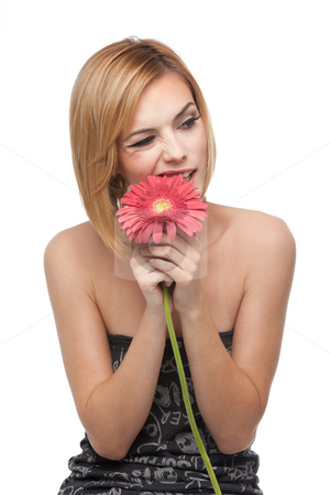 To use this stock image in your creative project, please select the size you need over to the right and click the "Add to Cart" button.
Your downloaded image will come with the Cutcaster watermark removed so don’t worry about the watermark you see on this page. Portrait of a young woman, biting on a flower's petals stock photo, A portrait of a young, blonde woman, playing with a red flower she holds with both her hands, biting on it's petals, with a funny expression on her face by dan comaniciu