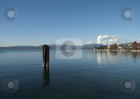 To use this stock image in your creative project, please select the size you need over to the right and click the "Add to Cart" button.
Your downloaded image will come with the Cutcaster watermark removed so don’t worry about the watermark you see on this page. Lake Garda stock photo, Overview of Lake Garda dawn by @ Photofollies by Carla Zagni