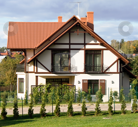 To use this stock image in your creative project, please select the size you need over to the right and click the "Add to Cart" button.
Your downloaded image will come with the Cutcaster watermark removed so don’t worry about the watermark you see on this page. Nice modern home architecture stock photo, Beautiful white home featuring modern architectural styling and large windows in Latvia by Tatjana Keisa