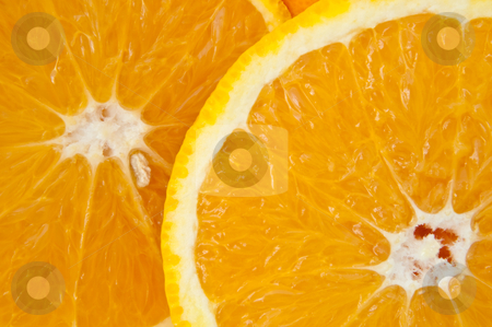 To use this stock image in your creative project, please select the size you need over to the right and click the "Add to Cart" button.
Your downloaded image will come with the Cutcaster watermark removed so don’t worry about the watermark you see on this page. Sunshine orange. stock photo, Close up of two fresh orange slices. by Samantha Craddock