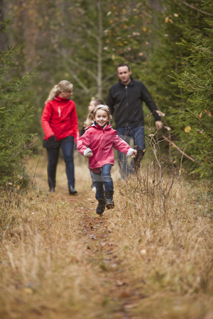 To use this stock image in your creative project, please select the size you need over to the right and click the "Add to Cart" button.
Your downloaded image will come with the Cutcaster watermark removed so don’t worry about the watermark you see on this page. Little Girl running stock photo, Little girl running in front of her family by Anne-Louise Quarfoth