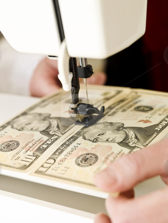 To use this stock image in your creative project, please select the size you need over to the right and click the "Add to Cart" button.
Your downloaded image will come with the Cutcaster watermark removed so don’t worry about the watermark you see on this page. Sewing money stock photo, Ten dollar bank notes in a sewing machine by Anne-Louise Quarfoth