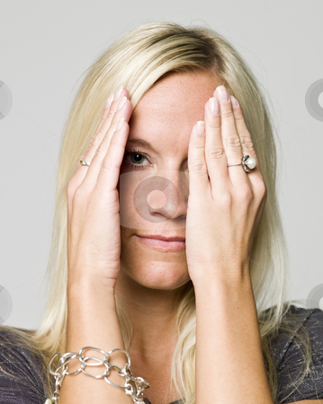 Portrait of a woman hiding in her hands Portrait of a woman hiding in her hands stock photo, Portrait of a woman hiding in her hands by Anne-Louise Quarfoth