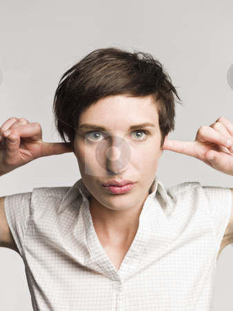 To use this stock image in your creative project, please select the size you need over to the right and click the "Add to Cart" button.
Your downloaded image will come with the Cutcaster watermark removed so don’t worry about the watermark you see on this page. Portrait of a woman with fingers in her ears stock photo, Portrait of a woman with fingers in her ears by Anne-Louise Quarfoth