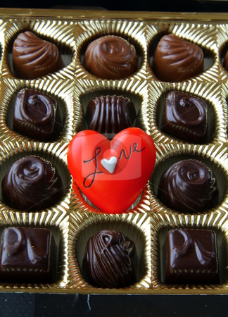 Chocolate with a red heart on Valentine's Day Chocolate with a red heart on Valentine's Day stock photo, by Olga Kriger