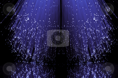 To use this stock image in your creative project, please select the size you need over to the right and click the "Add to Cart" button.
Your downloaded image will come with the Cutcaster watermark removed so don’t worry about the watermark you see on this page. Fibre optical violet cascade. stock photo, Low level angle capturing the ends of many illuminated violet fibre optic light strands against a black background in reflecting into the foreground. by Samantha Craddock