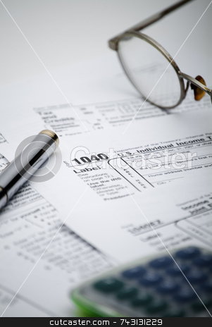 US 1040 Tax form US 1040 Tax form stock photo, Shallow focus view of a US 1040 tax form with calculator and glasses by Vince Clements