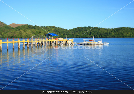 To use this stock image in your creative project, please select the size you need over to the right and click the "Add to Cart" button.
Your downloaded image will come with the Cutcaster watermark removed so don’t worry about the watermark you see on this page. Pier 3 stock photo, A pier from a resort leading to a boat by Jonas Marcos San Luis