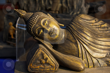 Sleeping budha wooden Sleeping budha wooden stock photo, Sleeping budha wooden in chiangrai temple. by smileidea