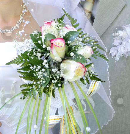 To use this stock image in your creative project, please select the size you need over to the right and click the "Add to Cart" button.
Your downloaded image will come with the Cutcaster watermark removed so don’t worry about the watermark you see on this page. Wedding bouquet stock photo, Beautiful white wedding bouquet in hands of the bride. by Pavel Vorobyov