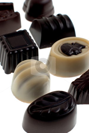 Dark, milk, and white chocolate Dark, milk, and white chocolate stock photo, Delicious dark, milk, and white chocolate pralines isolated on white background. by Homydesign