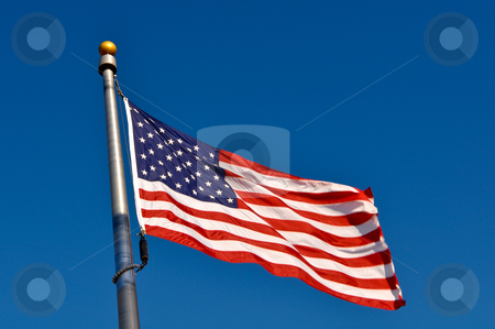 American Flag Blowing in Wind American Flag Blowing in Wind stock photo, American Flag Blowing in Wind by Brandon Bourdages