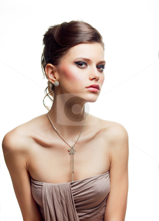 To use this stock image in your creative project, please select the size you need over to the right and click the "Add to Cart" button.
Your downloaded image will come with the Cutcaster watermark removed so don’t worry about the watermark you see on this page. Beauty portrait of a young woman in an evening outfit stock photo, a studio beauty portrait of a young woman, dressed in an evening outfit, shot on white background. by dan comaniciu