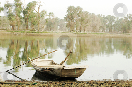 Boat at lake Boat at lake stock photo, Scenery of a wooden boat at a lake by John Young