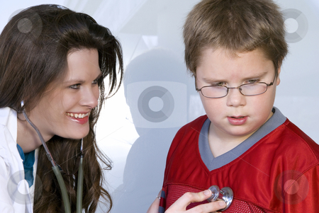 Female Pediatrician Female Pediatrician stock photo, A Female Pediatrician examining a young boy by Robert Byron