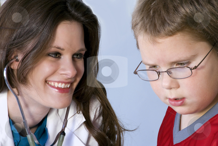 Female Pediatrician Female Pediatrician stock photo, A Female Pediatrician examining a young boy by Robert Byron