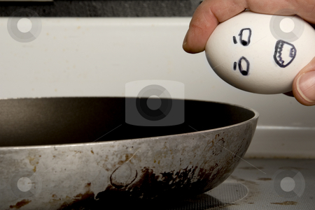 cutcaster-photo-800888027-Breaking-an-Eg