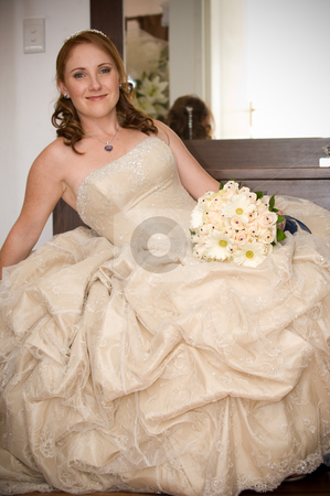 To use this stock image in your creative project, please select the size you need over to the right and click the "Add to Cart" button.
Your downloaded image will come with the Cutcaster watermark removed so don’t worry about the watermark you see on this page. Bride sitting leaning on arm smiling and holding white bouquet stock photo, red head sexy beautiful bride sitting with cleavage visible and leaning on her arm while smiling and holding her white flower bouquet by Ansunette