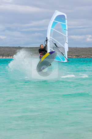 To use this stock image in your creative project, please select the size you need over to the right and click the "Add to Cart" button.
Your downloaded image will come with the Cutcaster watermark removed so don’t worry about the watermark you see on this page. Windsurf stock photo, Windsurfer jumping a wave in the lagoon, Babaomby, Madagascar by Pierre-Yves Babelon