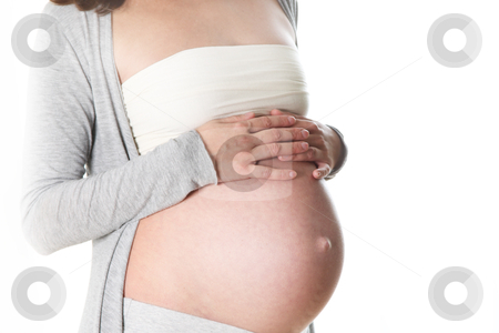Baby stomach of a pregnant woman Baby stomach of a pregnant woman stock photo, baby stomach of a pregnant woman. Only the abdomen is visible, the hands of the woman lying on her stomach protectively
by Christine Langer-Pueschel