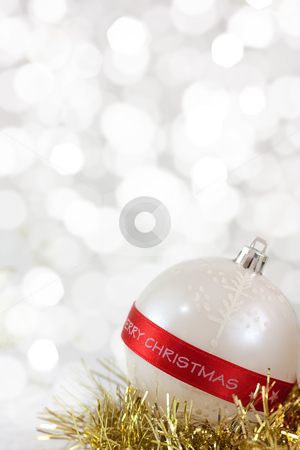Merry Christmas Bauble Merry Christmas Bauble stock photo, White Christmas bauble with Merry Christmas sign and light reflections on background of defocused lights
. Shallow DOF.
by borojoint