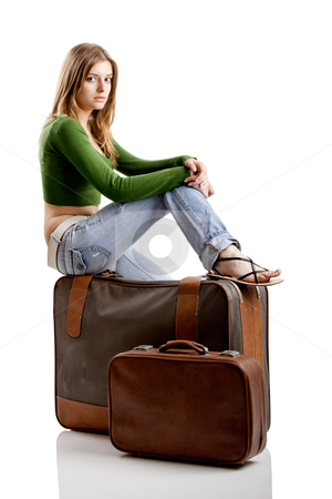 To use this stock image in your creative project, please select the size you need over to the right and click the "Add to Cart" button.
Your downloaded image will come with the Cutcaster watermark removed so don’t worry about the watermark you see on this page. Travel woman stock photo, Beautiful young woman seated and waiting with two old leather suitcases by ikostudio