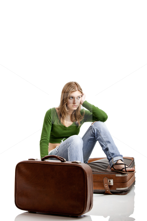 To use this stock image in your creative project, please select the size you need over to the right and click the "Add to Cart" button.
Your downloaded image will come with the Cutcaster watermark removed so don’t worry about the watermark you see on this page. Travel woman stock photo, Beautiful young woman seated amd waiting with two old leather suitcases by ikostudio