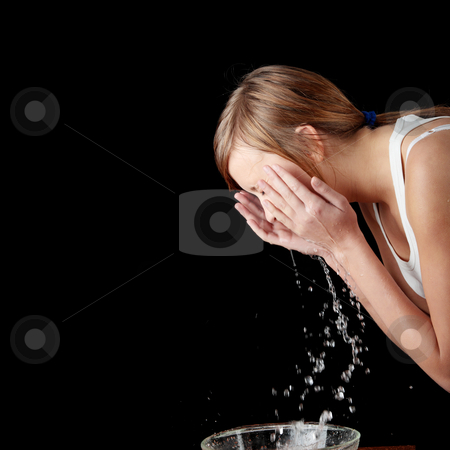 Teen girl washing her face with water Teen girl washing her face with water stock photo, Teen girl washing her face with water, isolated on black by Piotr_Marcinski
