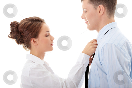 To use this stock image in your creative project, please select the size you need over to the right and click the "Add to Cart" button.
Your downloaded image will come with the Cutcaster watermark removed so don’t worry about the watermark you see on this page. Knotting the necktie stock photo, Businesswoman knotting the necktie of the businessman, helping and assisting him getting dressed. Isolated over white. by Piotr_Marcinski