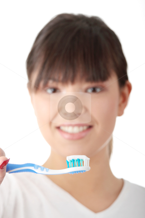 Teeth Teeth stock photo, Young beautiful woman washing her teeth with blue brush, isolated on white background - focus on brush by Piotr_Marcinski