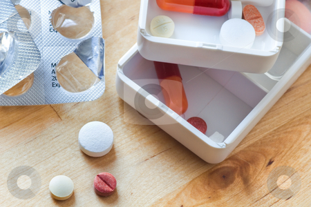To use this stock image in your creative project, please select the size you need over to the right and click the "Add to Cart" button.
Your downloaded image will come with the Cutcaster watermark removed so don’t worry about the watermark you see on this page. Tablets, capsules and pills sorted in pillboxes stock photo, Tablets, capsules and pills sorted in pillboxes for daily use as medication by Colette Planken-Kooij